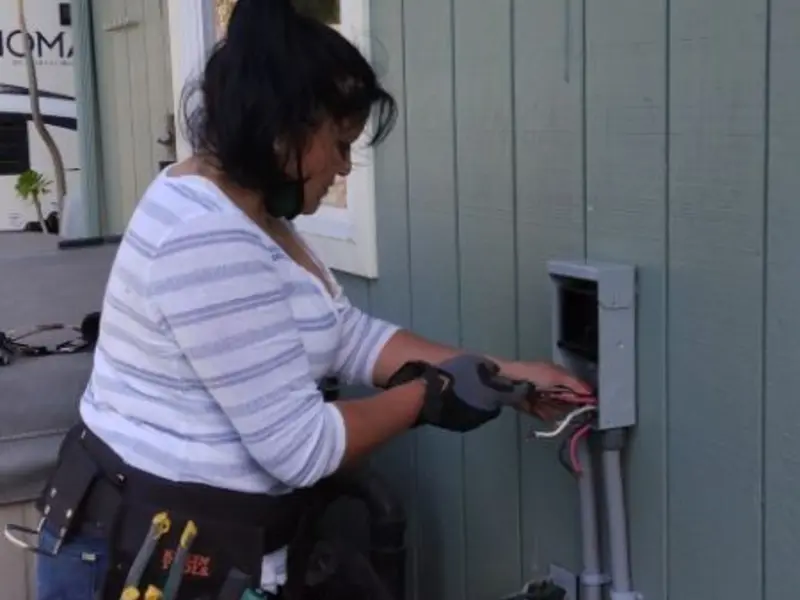 Licensed electrician wiring an exterior subpanel in Garden Ridge