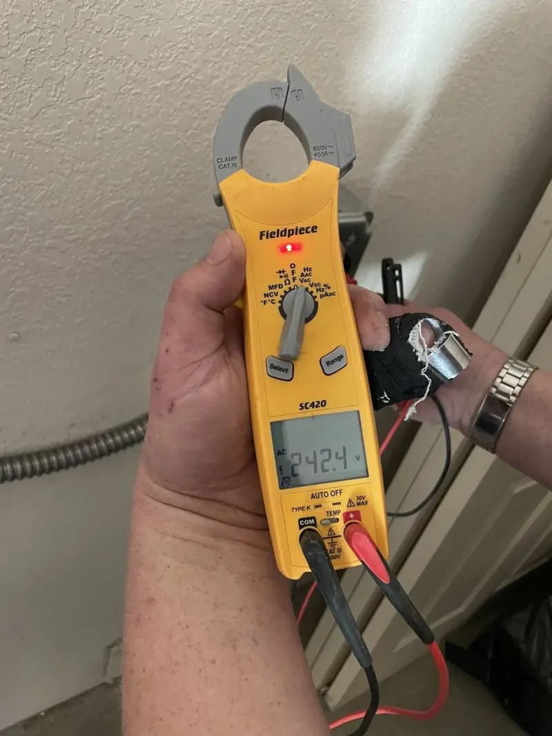 Voltage testing with clamp meter during Generator Installation in Garden Ridge